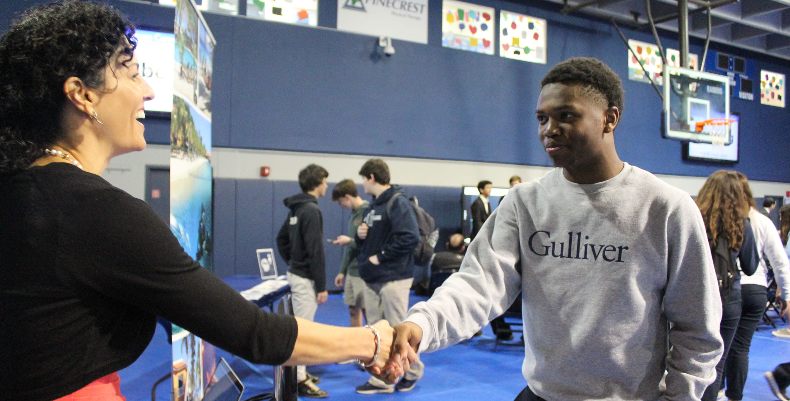 A Gulliver student meeting a professional at the school’s internship event